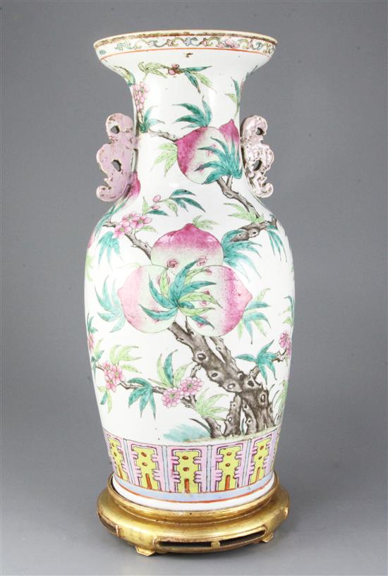 A large Chinese nine peach famille rose vase, 19th century, 45cm excluding gilt wood stand